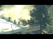 Rooftop fire erupts on school campus in LA