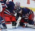 Hellebuyck all smiles in winning return from knee surgery