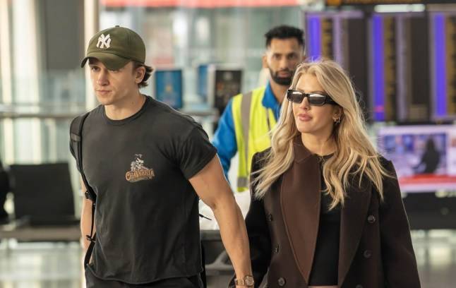 Pregnant Ellie Goulding is ‘so in love’ during huge PDA moment at airport