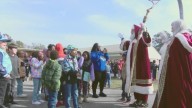 Santa and Mrs. Claus land in helicopter to greet elementary school students in Jefferson County