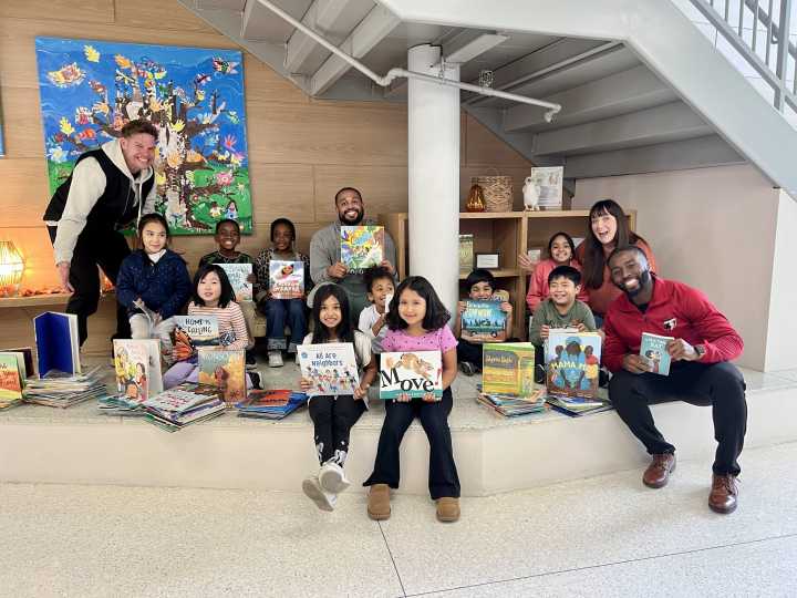 Local Business Gives Back to West Hartford School with Gift of Books and Time