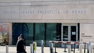 Trump is fighting the Institute of Peace in court. Now, his name is on the building