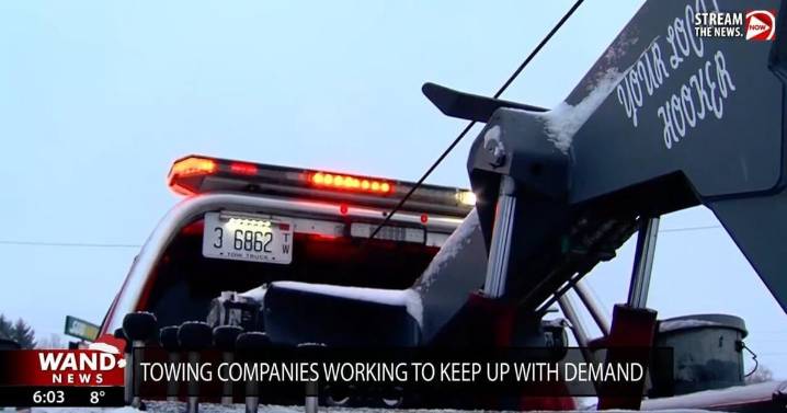Tow trucks busy after heavy snow hits central Illinois