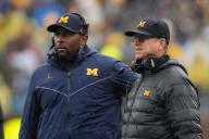 Jim Harbaugh has few words when asked about Sherrone Moore’s firing, arrest