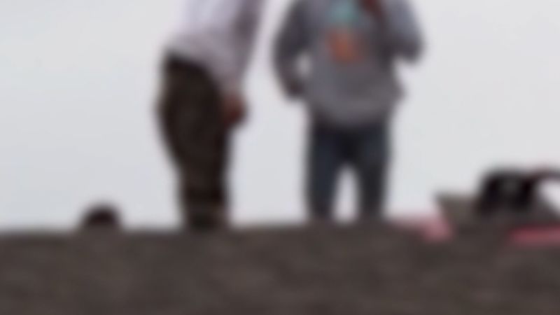 Two men appear to wait out Border Patrol agents on roof