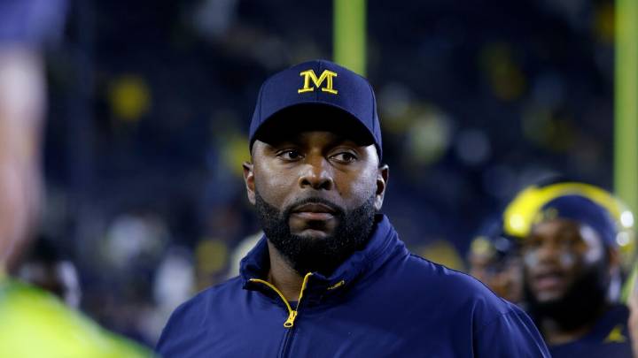 Fired Michigan football coach charged with home invasion and stalking