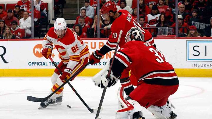 Flames can’t solve Bussi in OT loss to Hurricanes