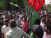 UDF workers celebrate outside Maharaja's College in Kochi