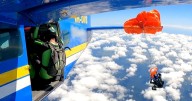 Skydiver suspended at 15,000 feet after parachute gets snagged on plane's tail