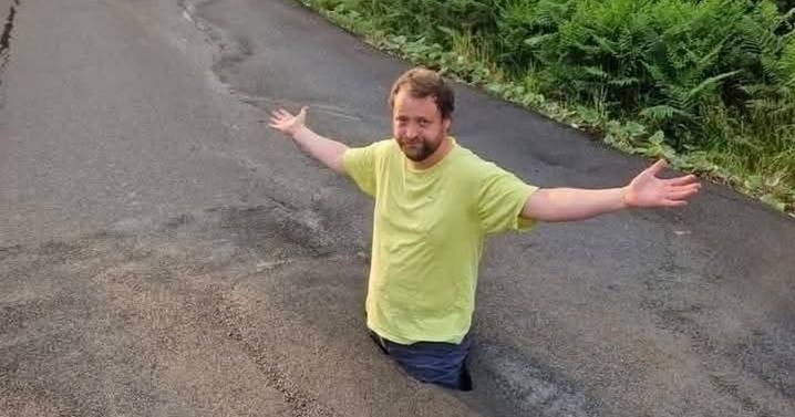 UK's worst pothole so deep a man stood waist deep in it is FINALLY filled