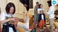 Japanese fan looks overwhelmed as she shakes Ram Charan's hand. Watch