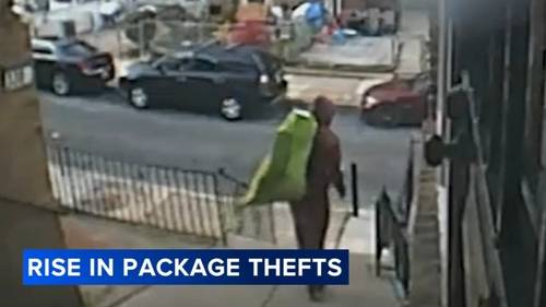 Porch 'Grinch' loads packages from porch into green bag as Philadelphia police warn of rising thefts