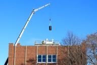 UND hoists laser lab equipment onto top of Witmer Hall Wednesday