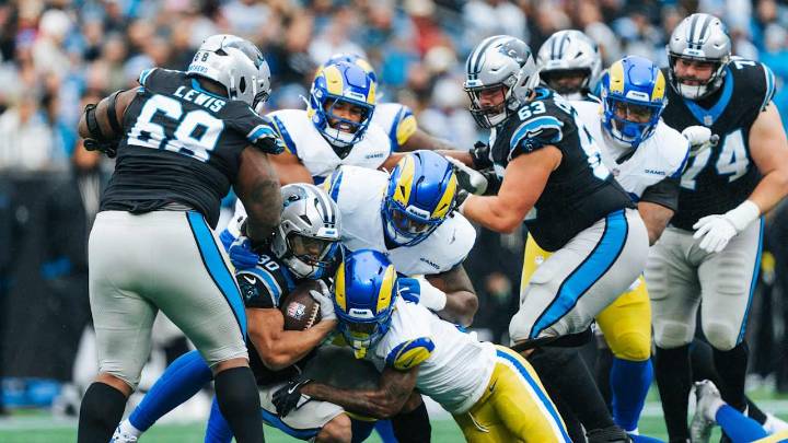 Offensive linemen live out their dream, pacing a big win in the rain