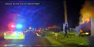 DRAMATIC VIDEO: Grand Island police pull man from burning vehicle after crash