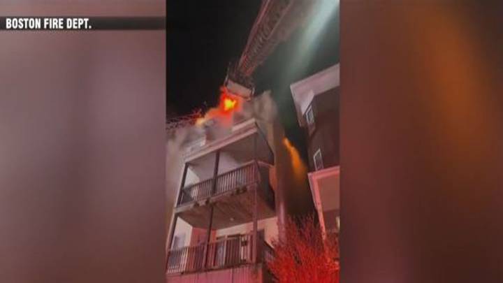 Multi-alarm blaze rips through triple-decker in Dorchester