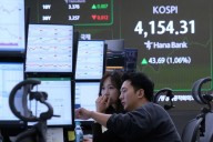 Asian shares track US stock market’s rise to record highs despite AI bubble worries