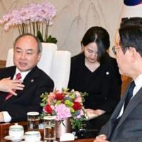 Softbank's Son says super AI could make humans like fish, win Nobel Prize