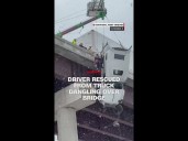 Driver rescued from tractor-trailer dangling from bridge in West Virginia