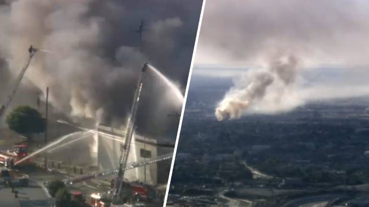 Firefighters protect buildings from fire at Boyle Heights business