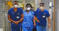 Hospitals tell staff and patients to wear masks again because of flu surge