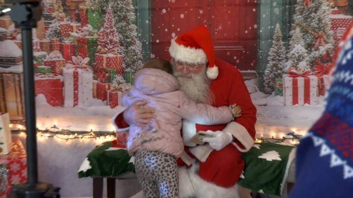 Santa visits Altoona auto shop, gives presents to families in need