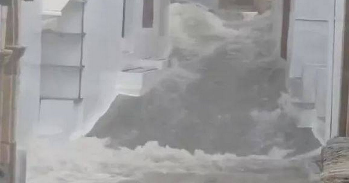 Brit holiday hotspot floods as 'red alert' storm kills two and turns streets to rivers