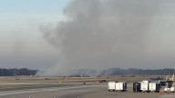 United flight turns around and evacuates at Dulles Airport after engine failure, brush fire