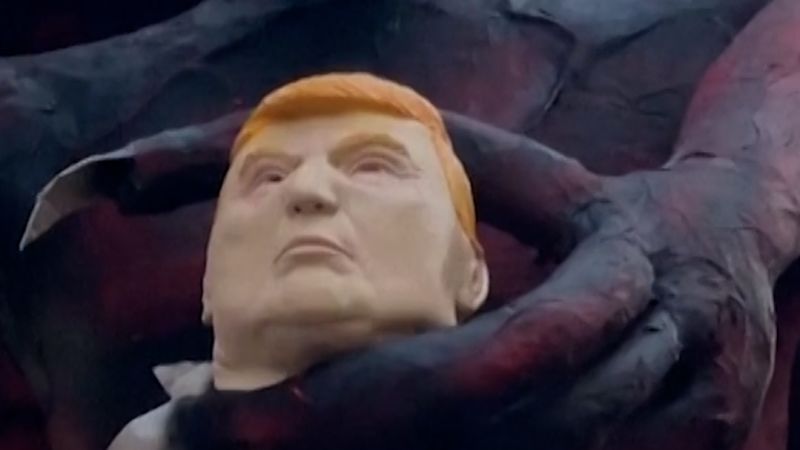 Why is this devil effigy holding the head of President Trump?