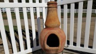 Give An Old Chiminea New Life As A Quirky Plant Stand And Garden Accent