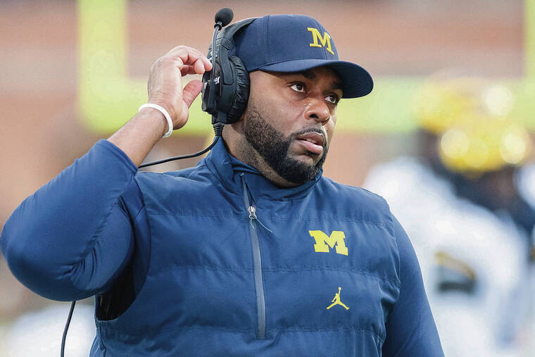 Michigan football coach detained after being fired