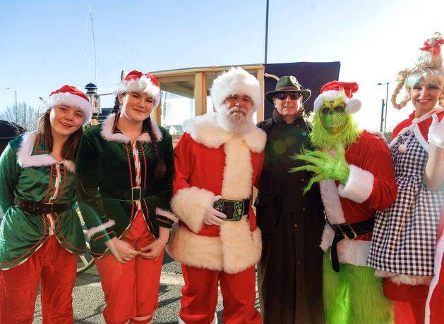 Santa Claus arrives in Arklow by lifeboat before being picked up by horse and carriage