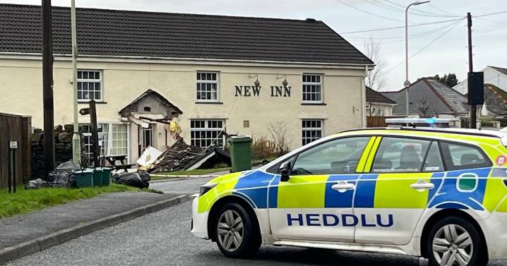 Bulldozer driven into pub and flattens car in suspected 'targeted' incident