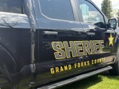 Hostage saved in officer-involved shooting in Grand Forks incident, according to report