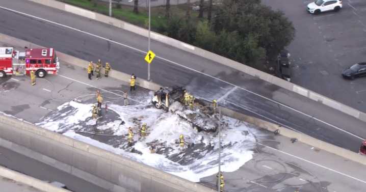 Part of 405 freeway closed in San Fernando Valley after hay truck catches fire