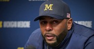 University of Michigan football coach detained after being fired