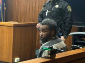 Saginaw man carried from court after murder conviction receives life sentence