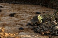 Indonesia promises action on any mining permit violations as Sumatra floods toll at about 800