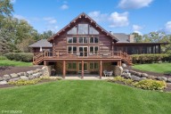 Orland Park 6-bedroom log cabin with fishing pond: $1.2M