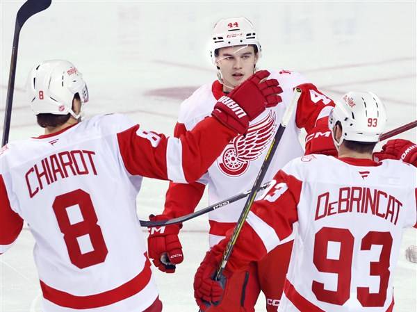 DeBrincat has 2 goals and an assist as Red Wings hold off Flames 4
