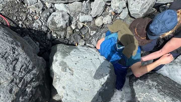 A 700-pound boulder pinned Alaska man face down in a glacier creek for 3 hours