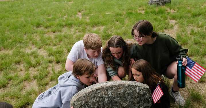 Orchard Prairie students tidy small cemetery, graves of prairie pioneers in historic school district