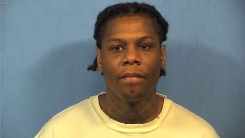 Man detained on charges of being a felon with a gun