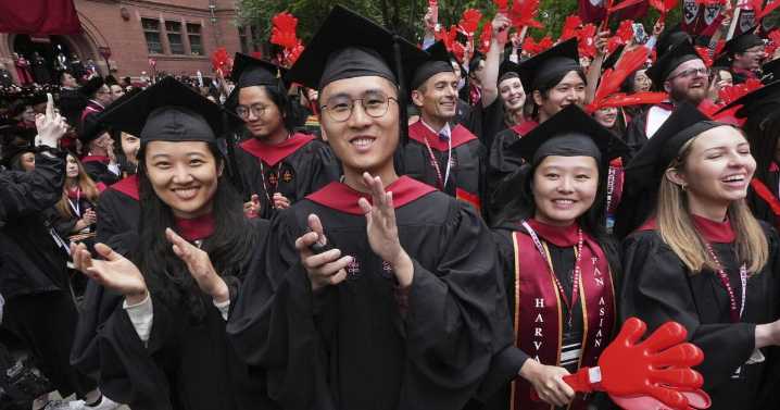 Harvard grads cheer commencement speakers who urge the school to stand strong