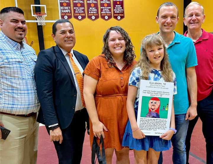 Parents sneak into school to watch their children win SPI family vacations