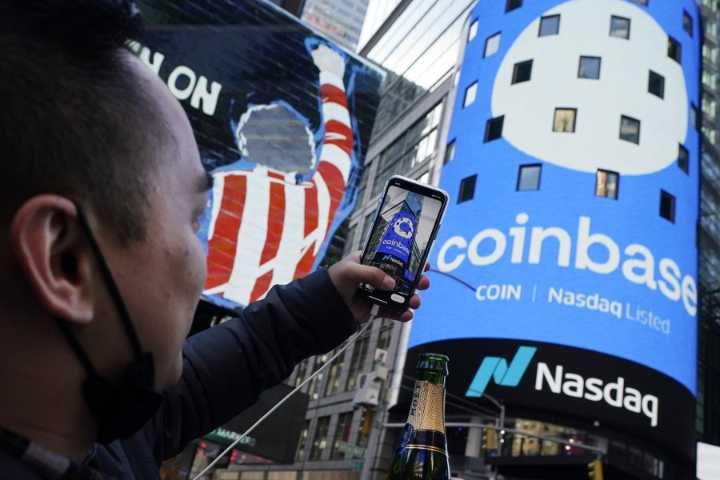 After rocky week, Coinbase becomes first crypto exchange to join the S&P 500
