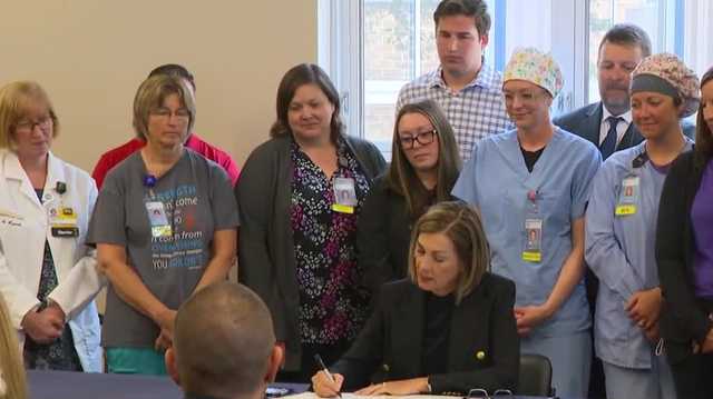 Gov. Kim Reynolds signs into law rural health care, medical residency expansion proposal