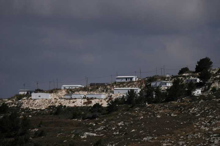 Israel authorizes more settlements in the occupied West Bank. Strikes on Gaza kill 13, officials say