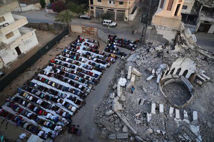 Gaza marks the start of Eid with outdoor prayers amongst the rubble and food growing ever scarcer