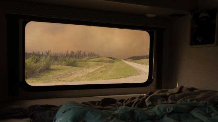 Thousands evacuated as wildfires sweep across Canadian provinces, air quality worsens